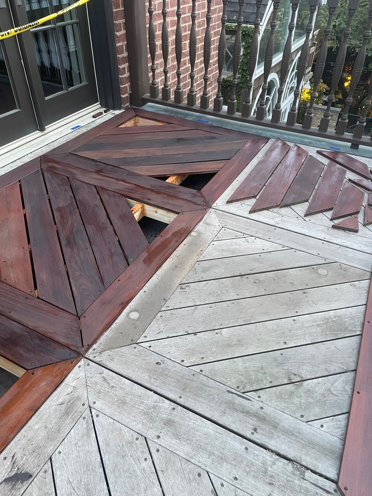 Ipe deck boards being oiled and sealed in fall before winter in Lake County IL