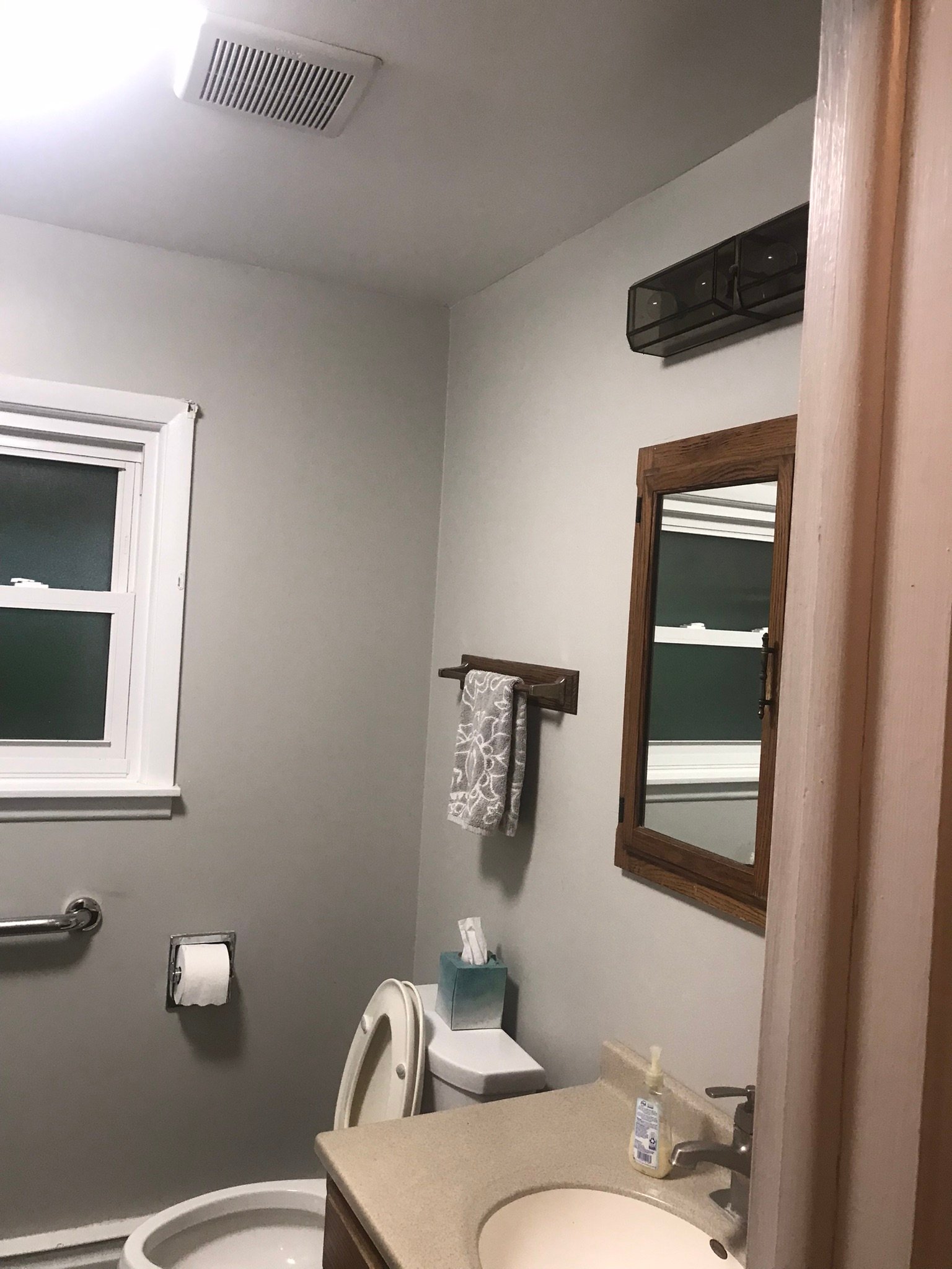 Dated bathroom before a full remodel by Real Construction in Buffalo Grove IL